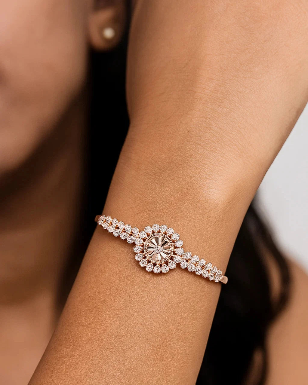 Rose gold bracelet with a diamond on a wrist