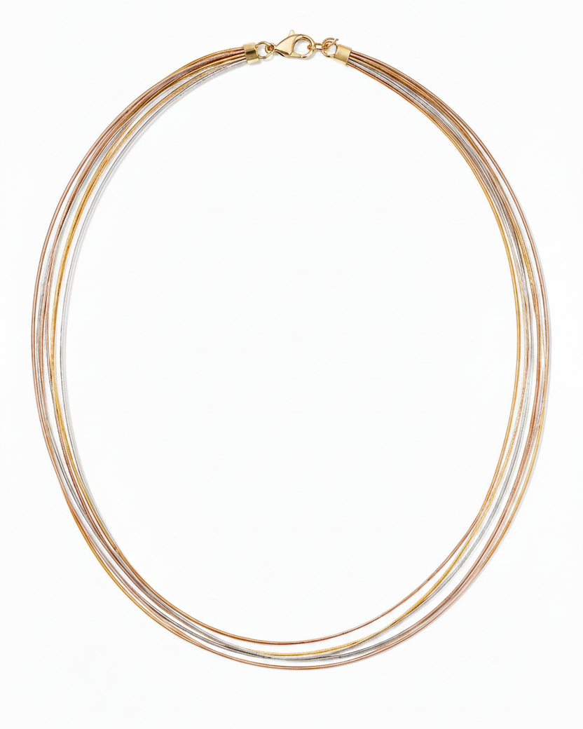 Necklace with multiple gold and silver strands on a white background