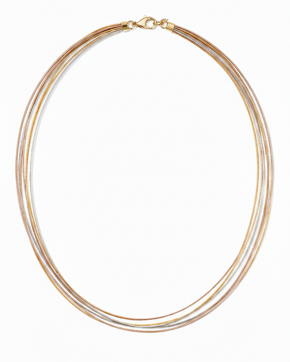 Necklace with multiple gold and silver strands on a white background