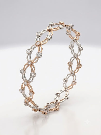 Two-toned bracelet with interlocking links on a light gray background