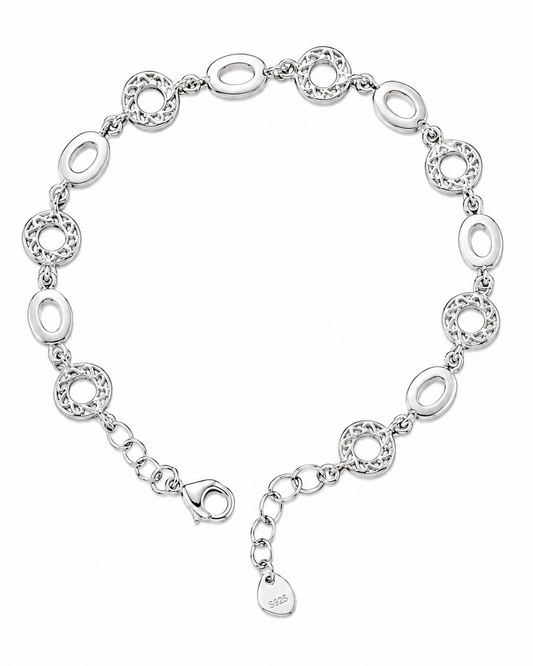 Silver bracelet with interlocking loops on a white background