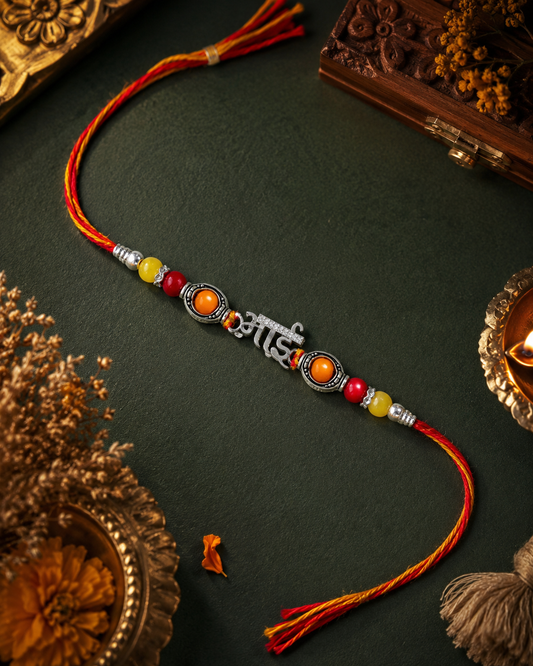 "Bhai" Rakhi with Red, Orange, and Yellow Auspicious Beads