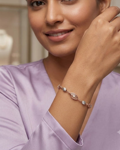 Woman wearing a bracelet, smiling, with a blurred background
