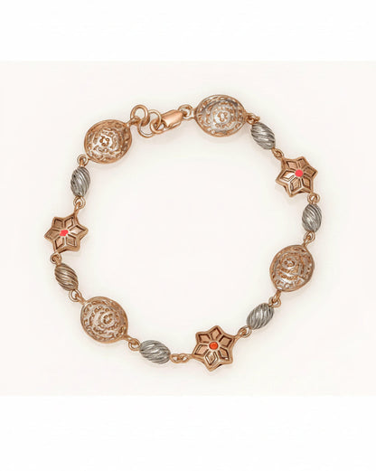 Decorative bracelet with gold and silver beads on a white background