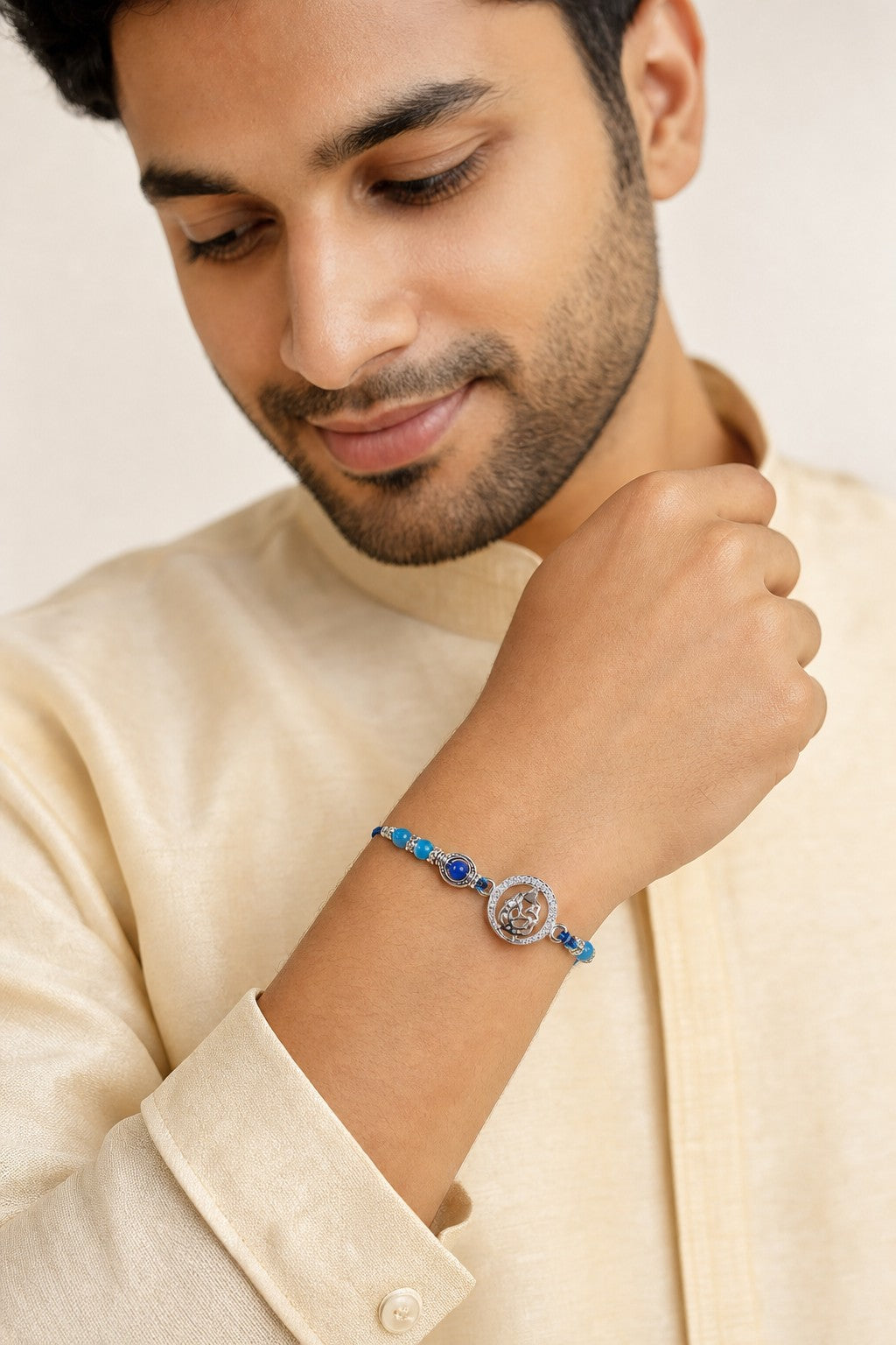 Lord Ganesha Rakhi Bracelet with Blue Beads & CZ Halo - ARU-RAK-0004_model