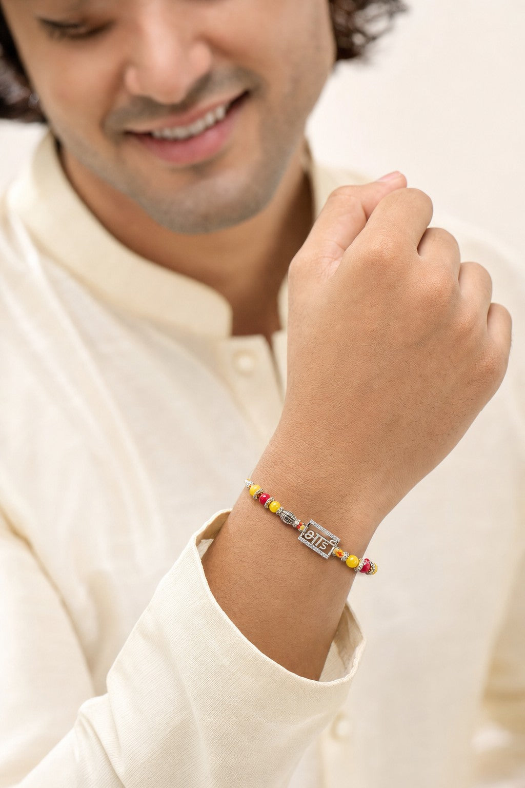 Bhai Script Silver Rakhi Bracelet with Yellow & Red Beads - ARU-RAK-0012_model
