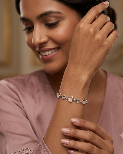 Woman wearing a silver bracelet with a blurred background