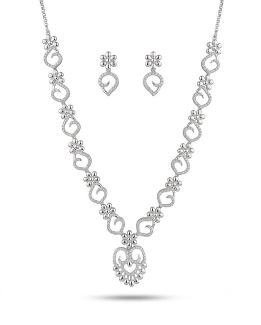 Silver necklace and earrings set on a white background