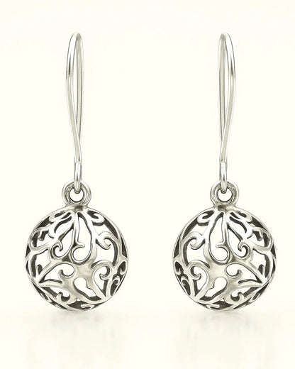 Pair of silver earrings with intricate designs on a white background