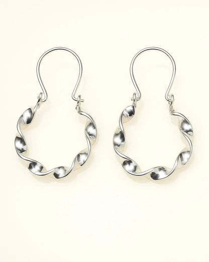Pair of silver hoop earrings on a white background