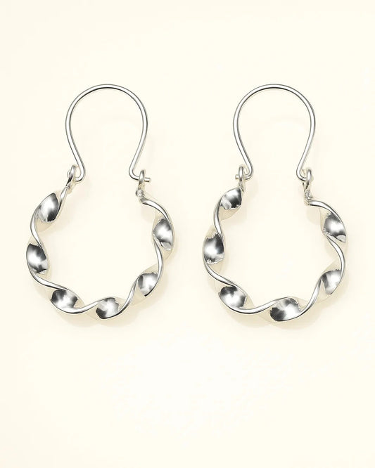 Pair of silver hoop earrings on a white background