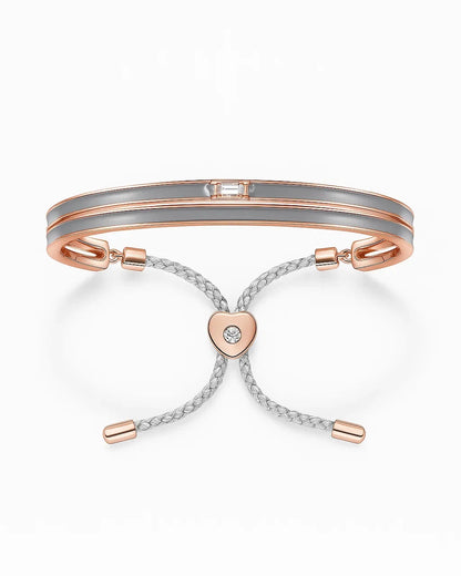 Rose Gold Bracelet with heart-shaped charm on a white background