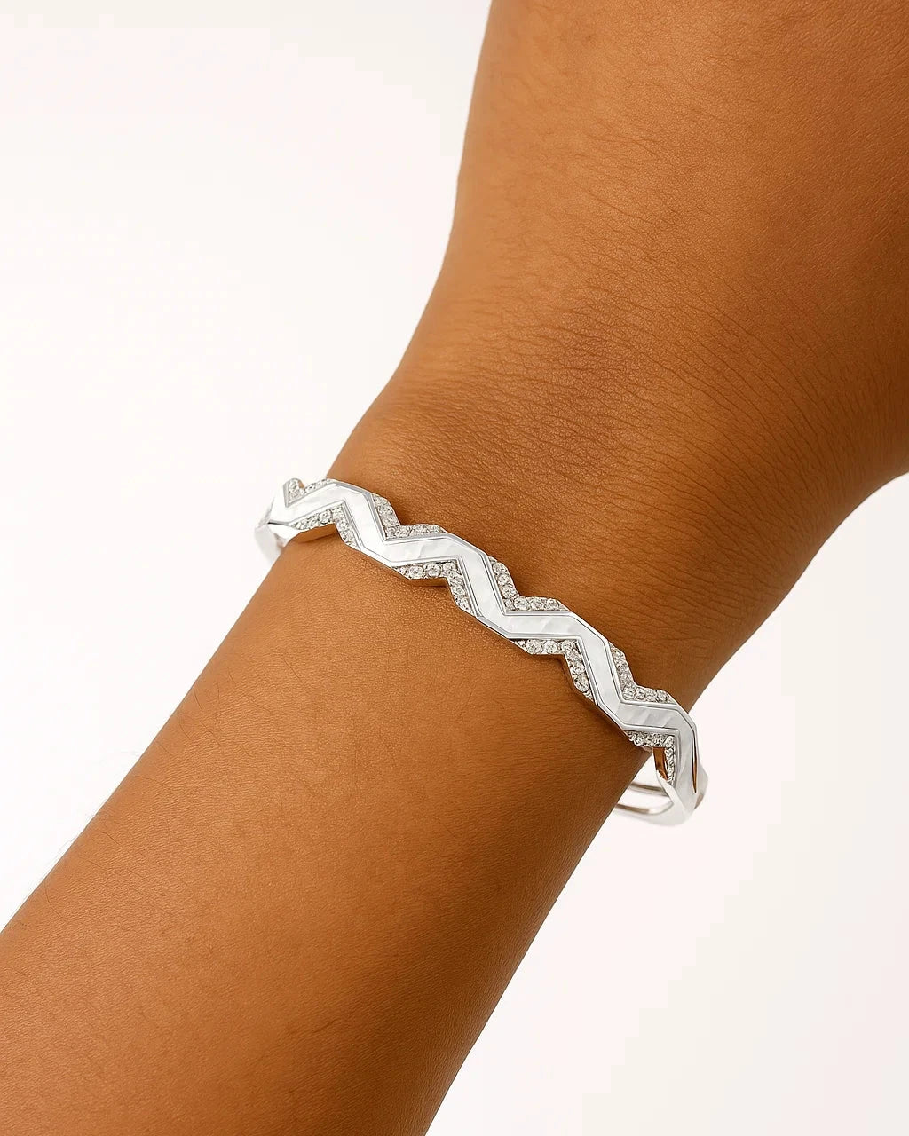 Silver zigzag bracelet on a wrist 