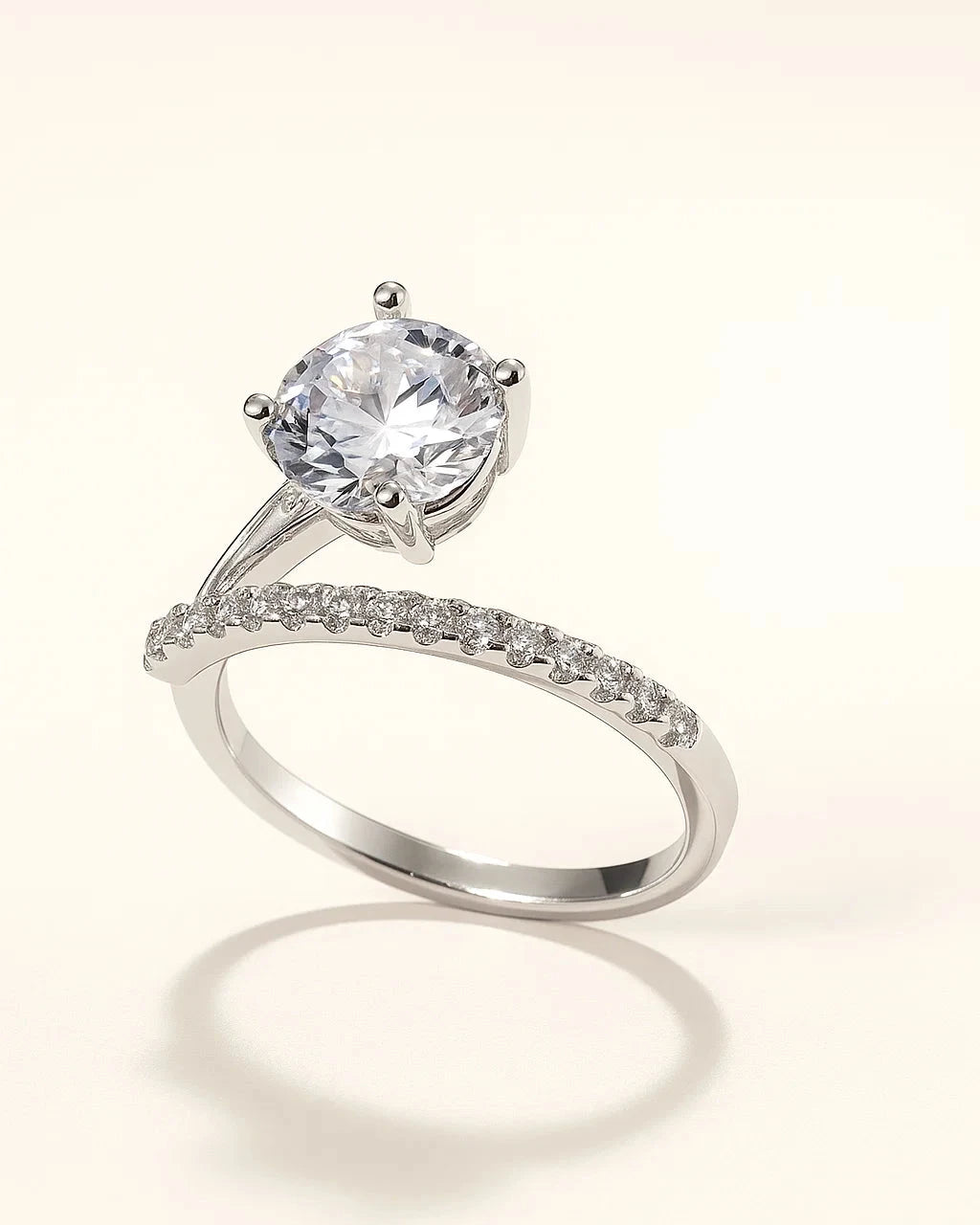 Silver ring with a large central gemstone and smaller stones 