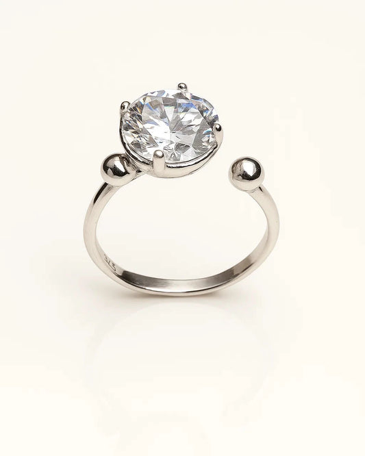 Silver ring with a large central gemstone 