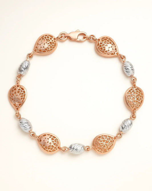 Rose gold and silver bracelet on a light beige background