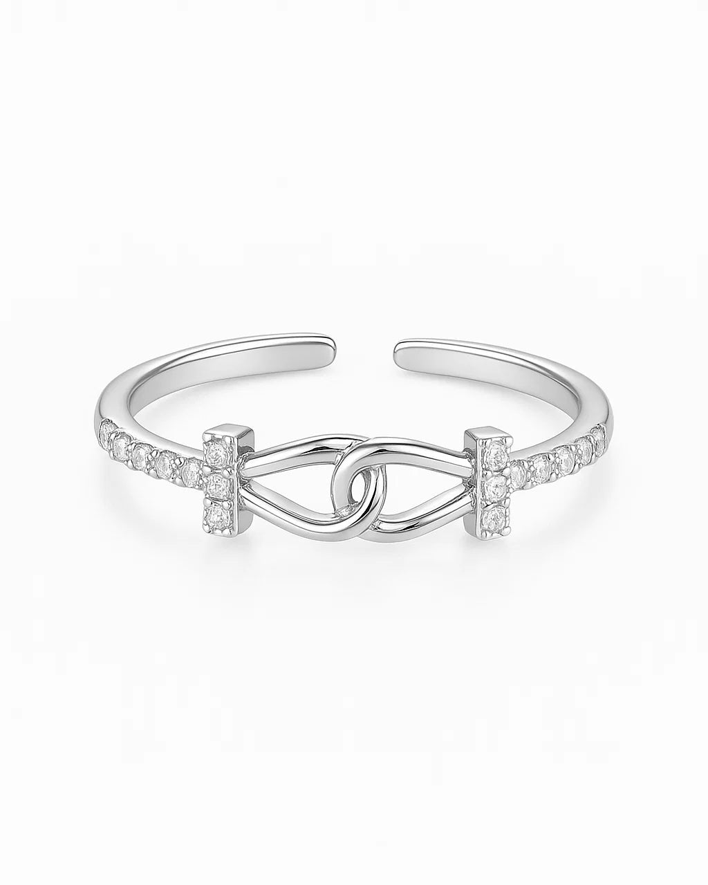 Silver ring with interlocking design on a white background