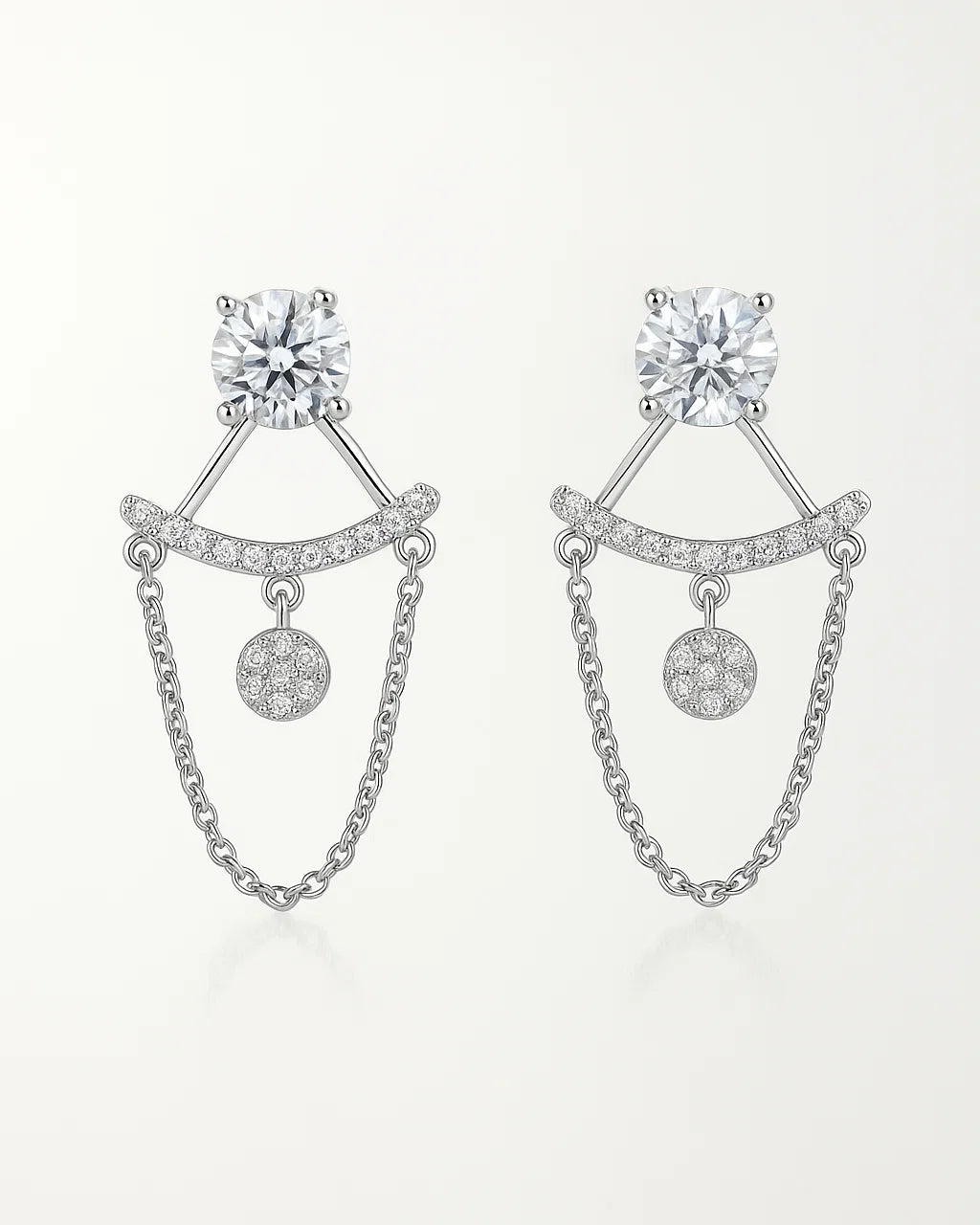 Pair of silver earrings with chain details on a white background