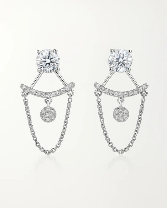 Pair of silver earrings with chain details on a white background