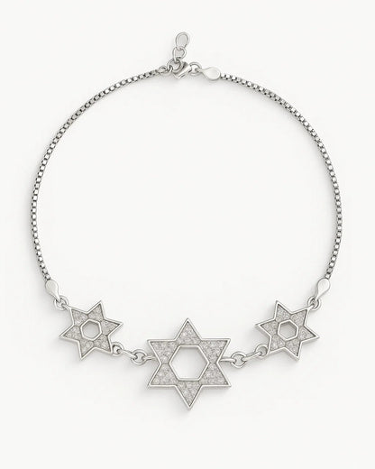Silver bracelet with star designs on a white background