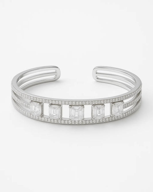 Silver bracelet with diamond accents on a white background