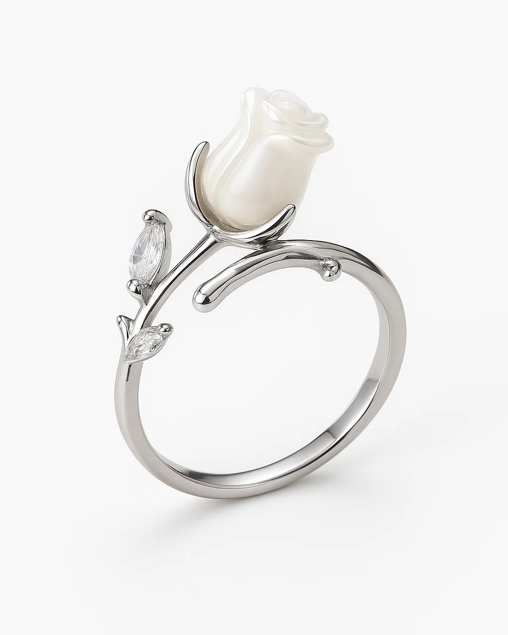 Silver ring with a white rose design on a white background
