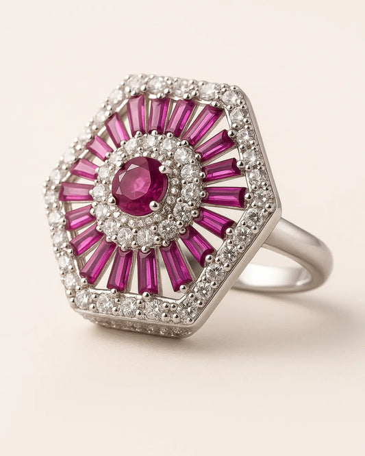 Elegant ring with pink gemstones and white accents on a light background