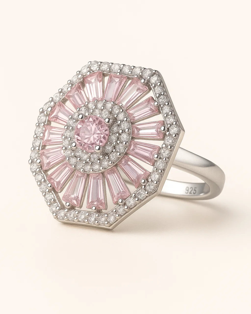 Pink gemstone ring with silver accents on a white background