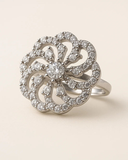 Silver ring with diamond floral design on a beige background