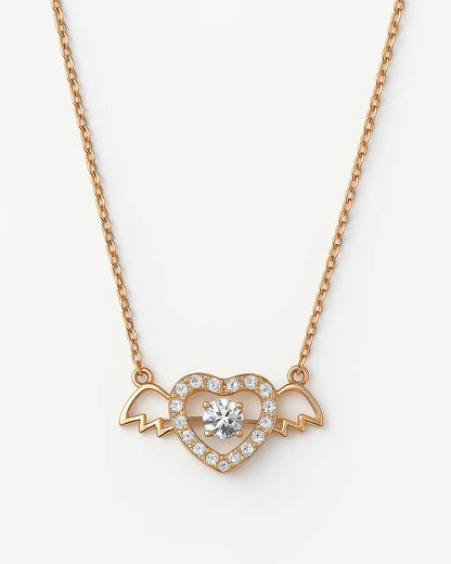 Heart-shaped necklace with a central gemstone on a white background